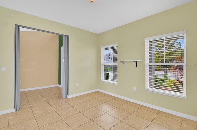 empty room with light tile patterned floors