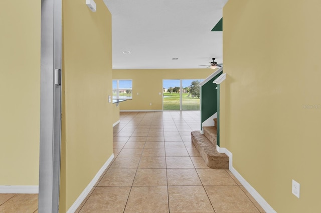 hall with light tile patterned flooring