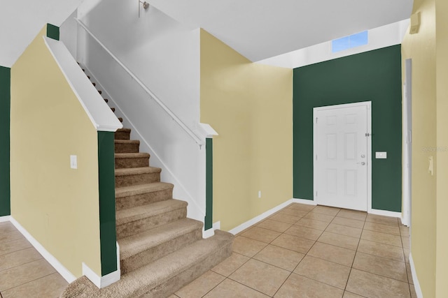 foyer entrance with light tile patterned floors