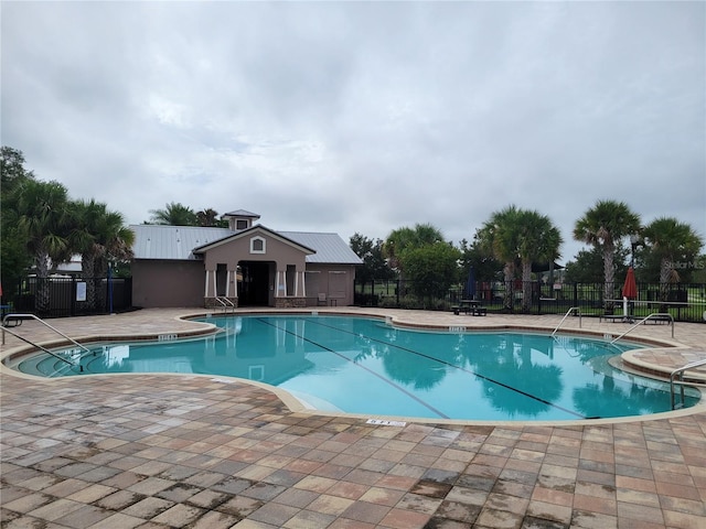 view of swimming pool featuring a patio