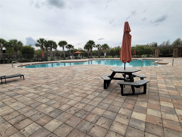 view of swimming pool with a patio area