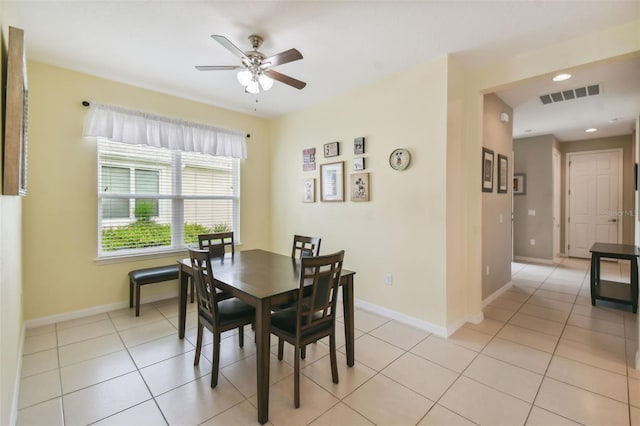 dining space featuring light tile patterned floors and ceiling fan