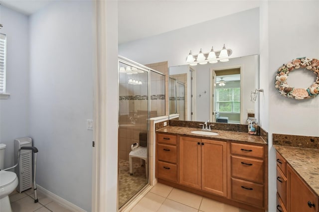 bathroom with vanity, toilet, an enclosed shower, and tile patterned floors