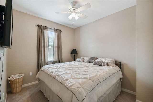 bedroom featuring ceiling fan and carpet