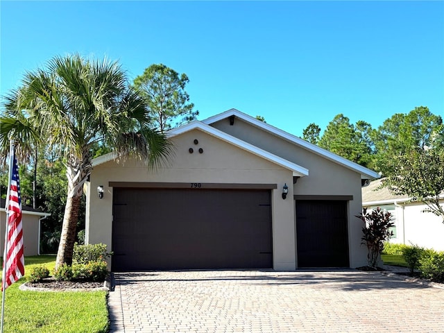 ranch-style home featuring a garage