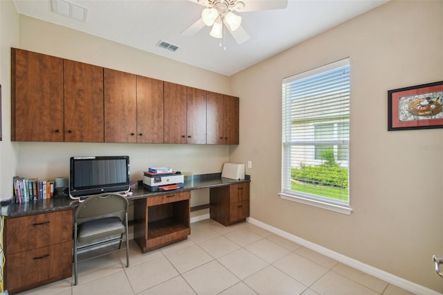 tiled office space featuring ceiling fan