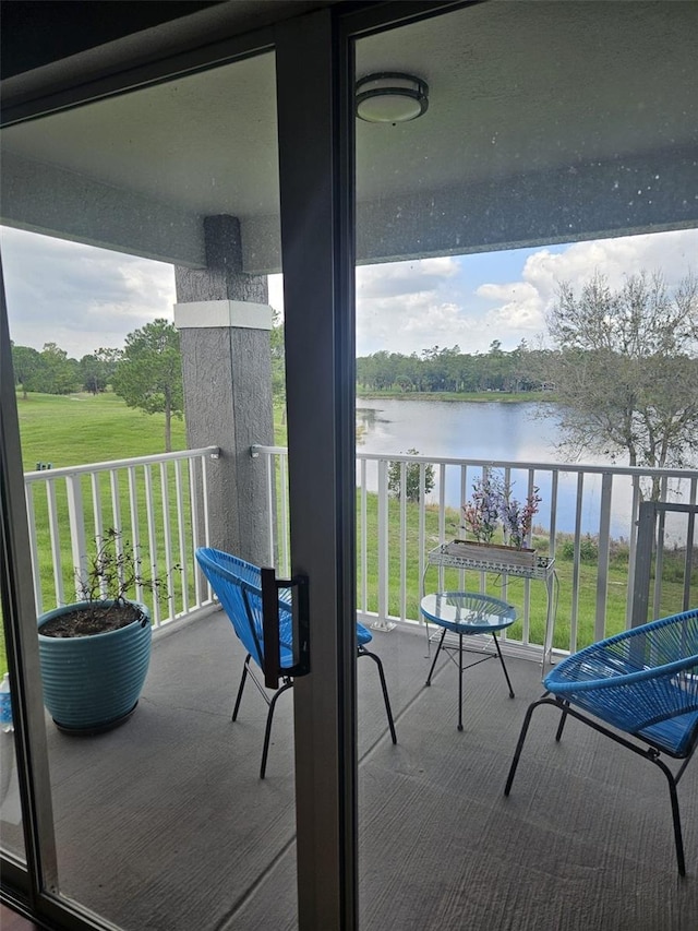 balcony featuring a water view