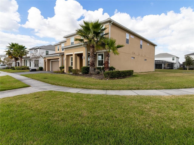 view of side of home with a lawn and a garage