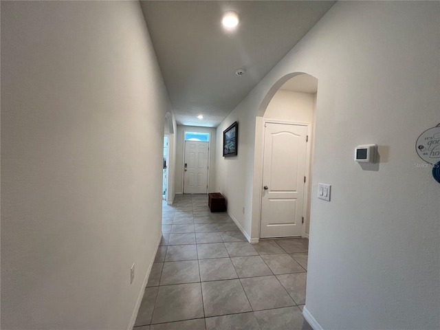 hallway with light tile patterned flooring