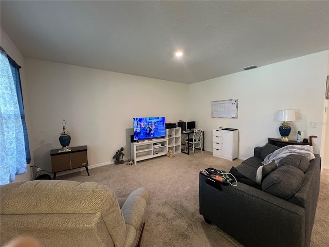 living area featuring carpet floors, baseboards, and visible vents