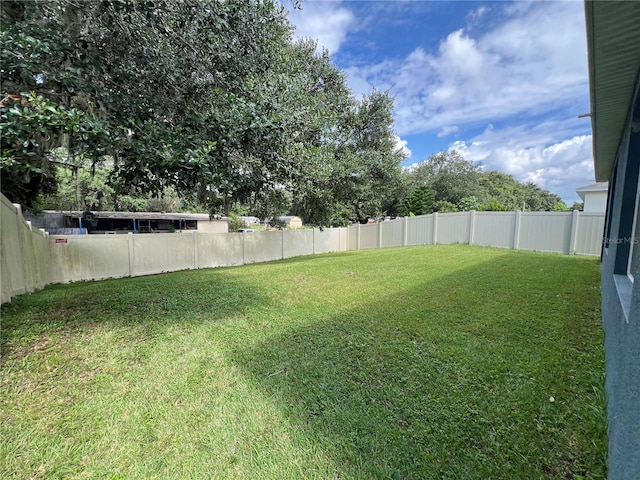 view of yard featuring a fenced backyard