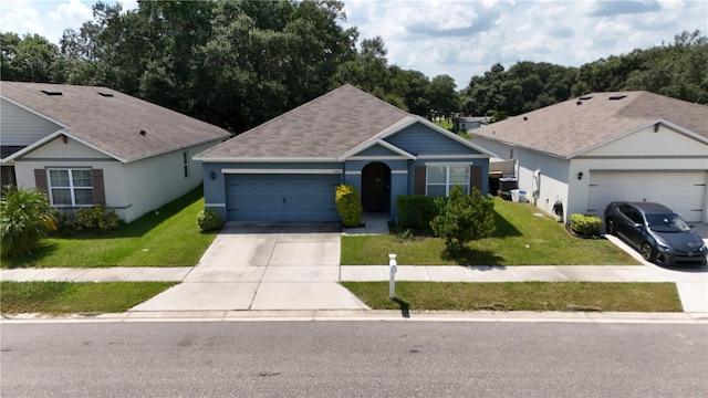 single story home with an attached garage, a shingled roof, driveway, stucco siding, and a front yard