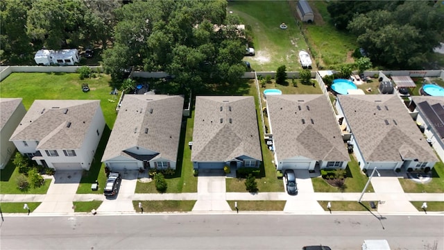 birds eye view of property with a residential view