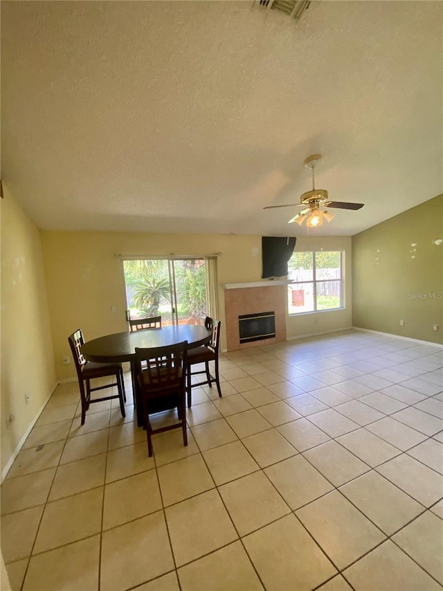 interior space with a textured ceiling and ceiling fan