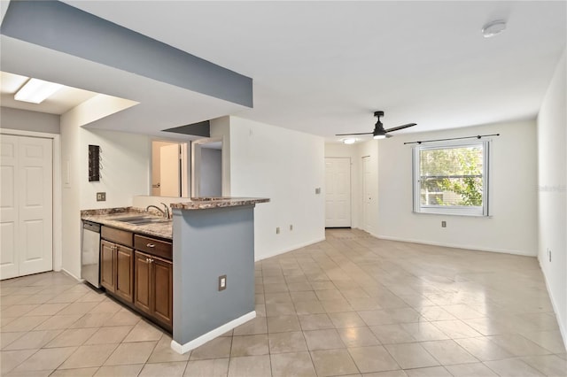 kitchen with ceiling fan, stainless steel dishwasher, sink, and light tile patterned floors