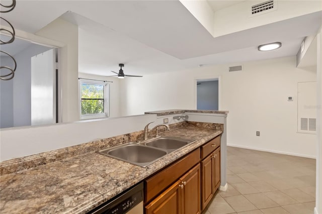 kitchen featuring ceiling fan, sink, and light tile patterned flooring