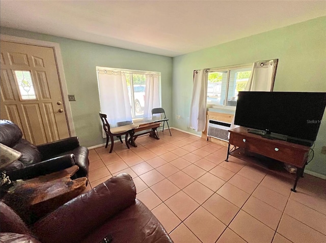 living room with a healthy amount of sunlight and light tile patterned floors