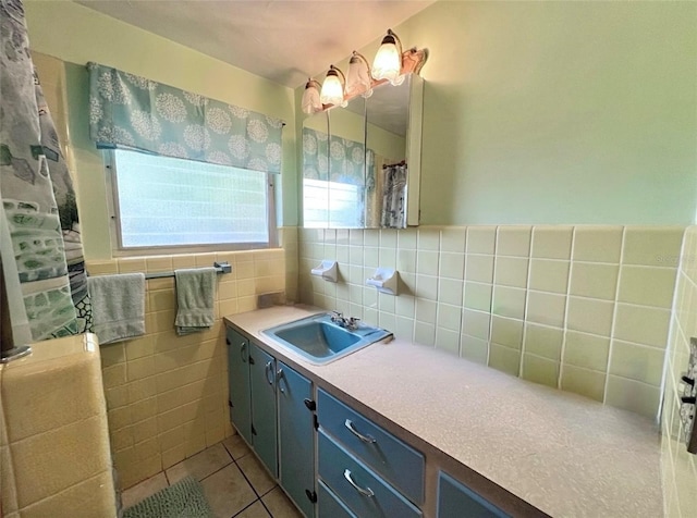 bathroom featuring backsplash, tile patterned flooring, vanity, and tile walls