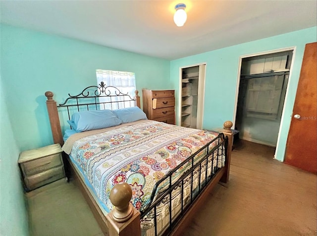 bedroom featuring multiple closets