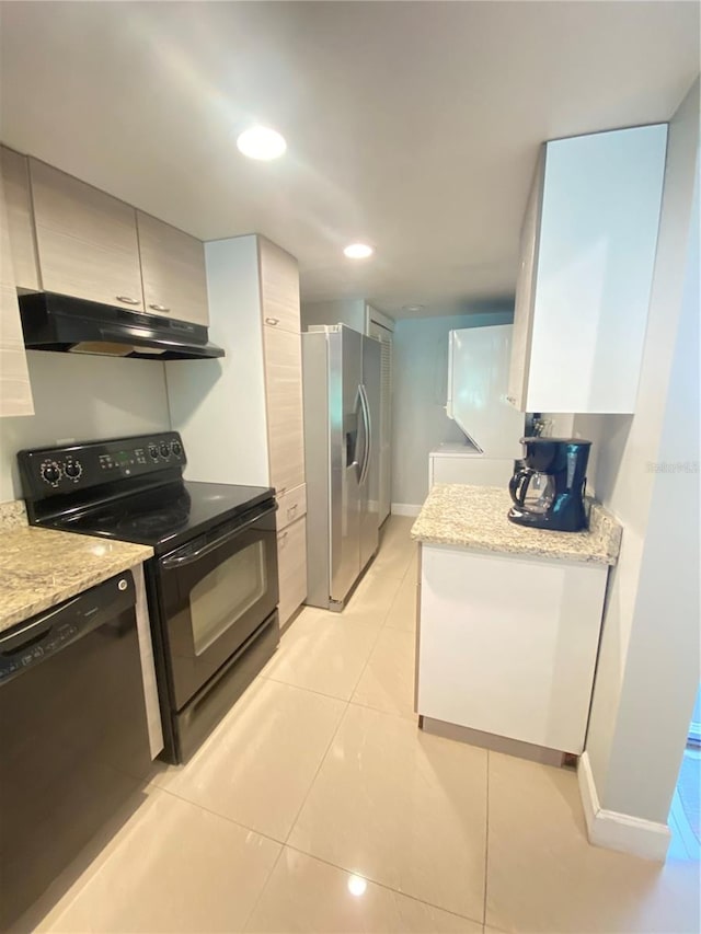 kitchen featuring dishwasher, range, light stone countertops, stainless steel fridge with ice dispenser, and light tile patterned floors