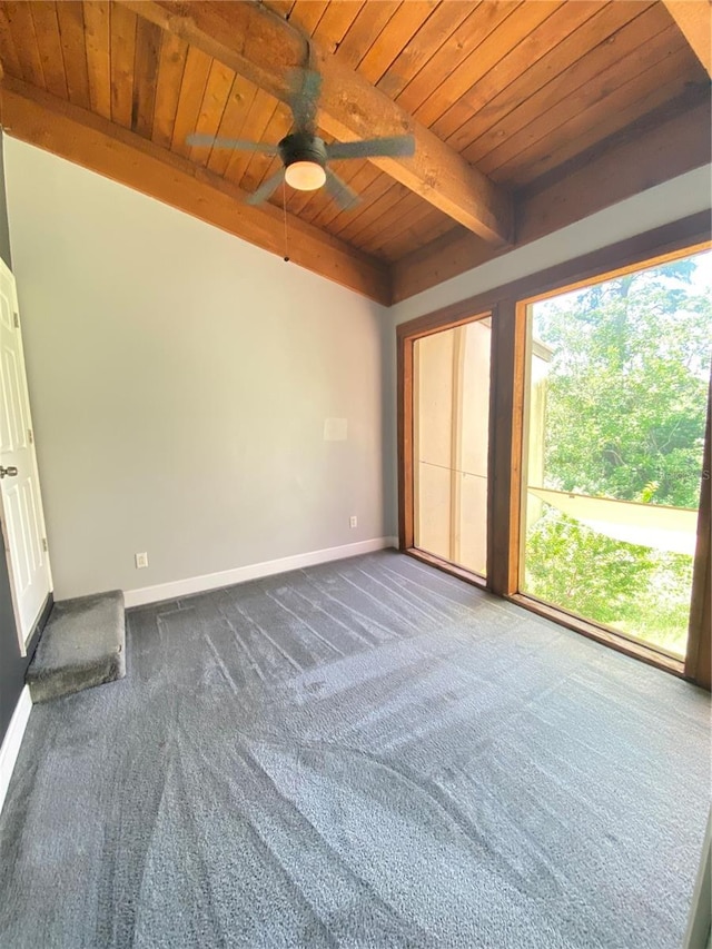 spare room featuring ceiling fan, carpet, wooden ceiling, and beamed ceiling