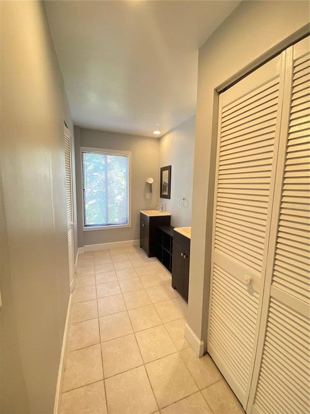 corridor featuring light tile patterned flooring