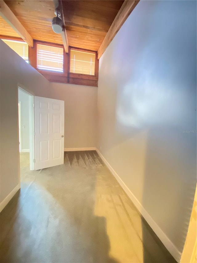 basement with wood ceiling and carpet floors