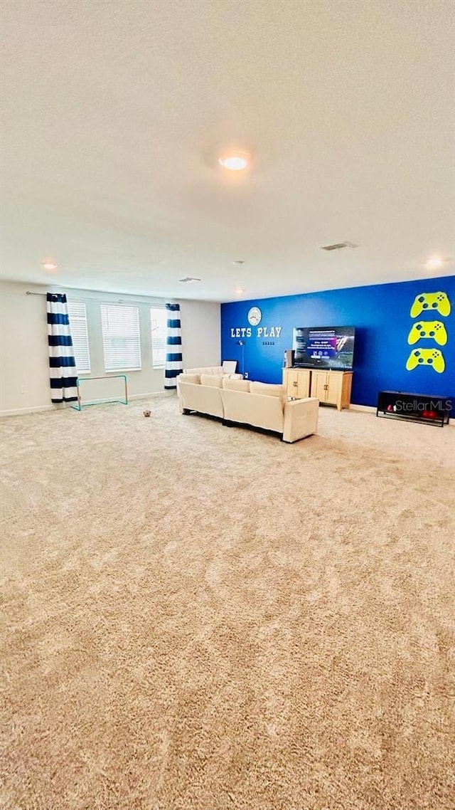 interior space with carpet and a textured ceiling