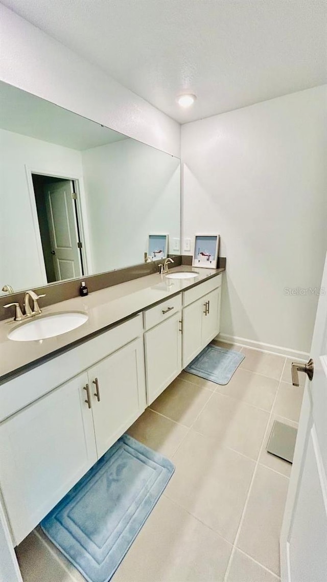 bathroom featuring tile patterned floors and vanity