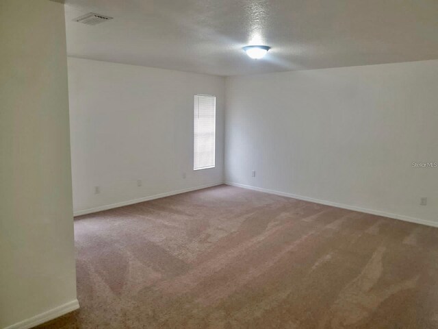 empty room featuring carpet flooring