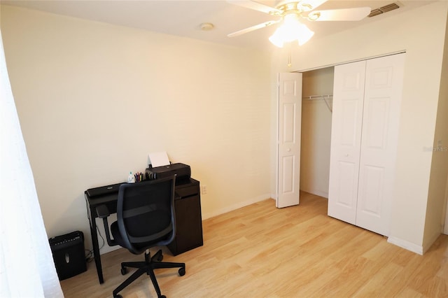 office area with ceiling fan and light hardwood / wood-style floors