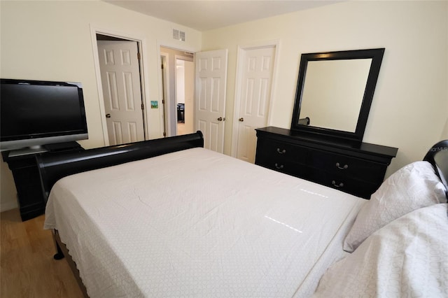 bedroom featuring hardwood / wood-style flooring