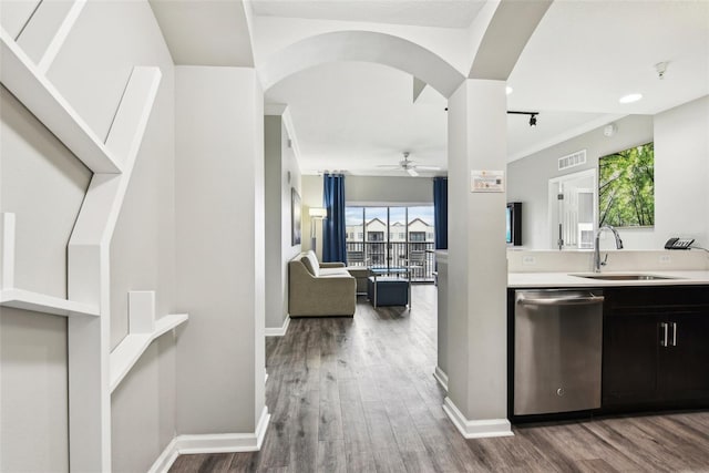 kitchen featuring dishwasher, hardwood / wood-style floors, sink, crown molding, and ceiling fan