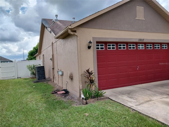 exterior space with a yard and central AC unit