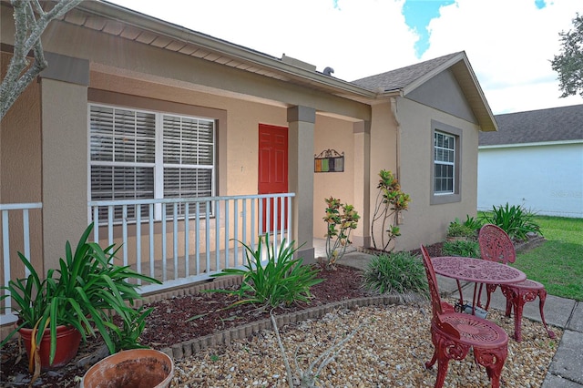 doorway to property with covered porch