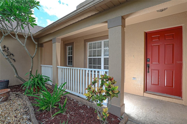 property entrance with covered porch