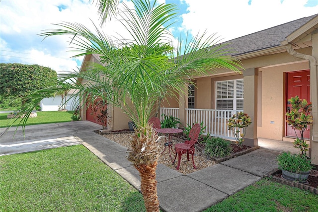 exterior space with a garage and covered porch