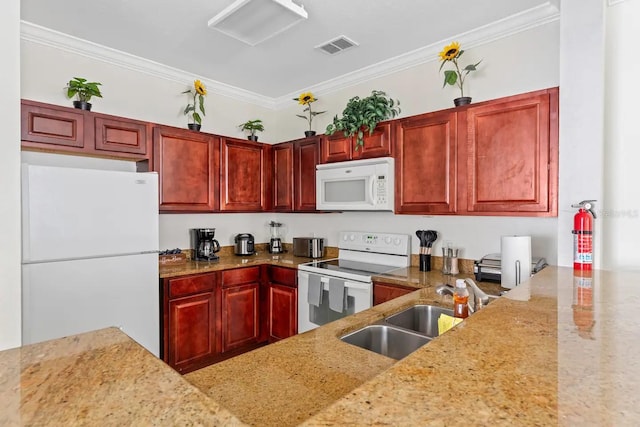 kitchen featuring sink, light stone counters, white appliances, and ornamental molding