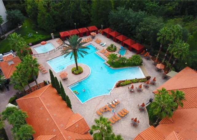 view of pool with a patio area and a community hot tub