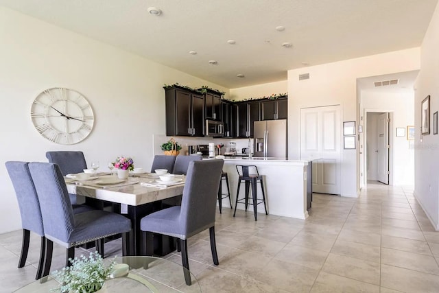 dining space with light tile patterned flooring