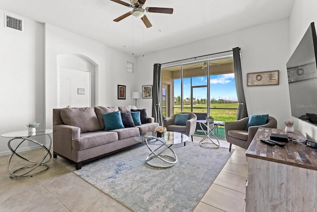 living room featuring ceiling fan and light tile patterned flooring