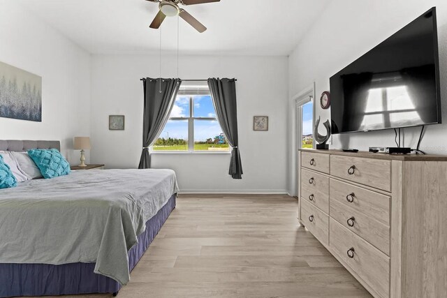 bedroom featuring ceiling fan and light hardwood / wood-style flooring