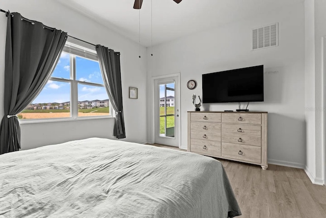 bedroom with ceiling fan and light hardwood / wood-style floors