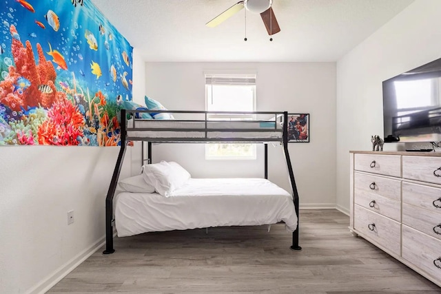 bedroom featuring ceiling fan and light hardwood / wood-style floors