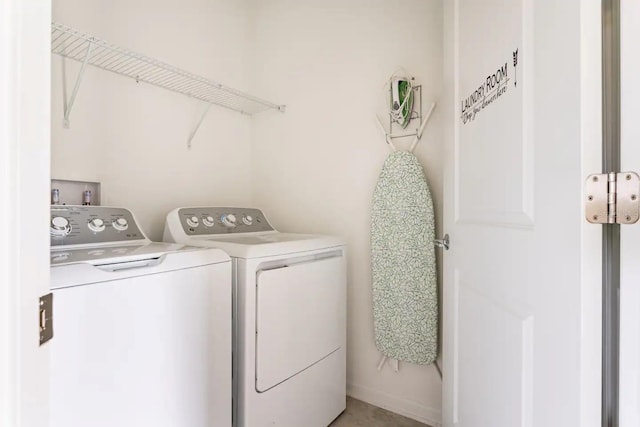 laundry room with independent washer and dryer