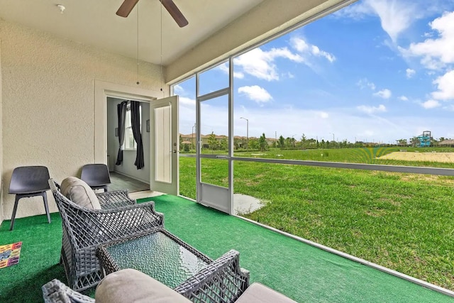 sunroom / solarium with ceiling fan