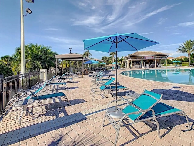 view of swimming pool with a gazebo and a patio area