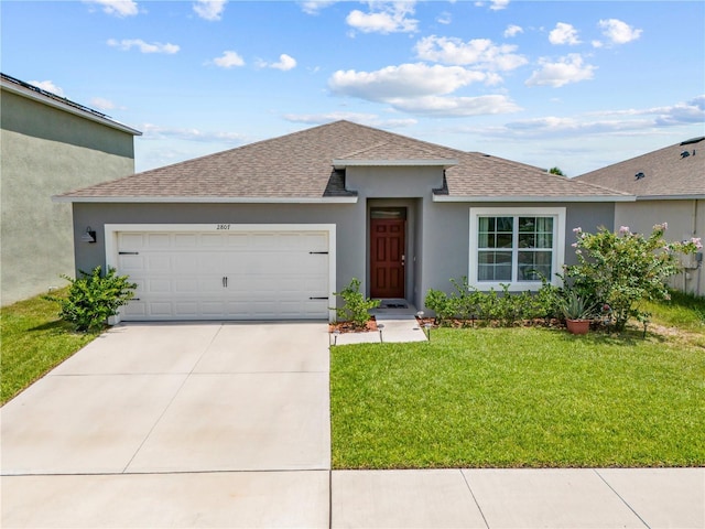 ranch-style home with a garage, a shingled roof, driveway, stucco siding, and a front yard