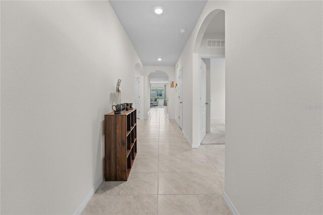 hallway with light tile patterned floors