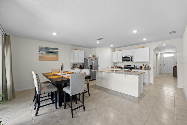 tiled dining space with sink